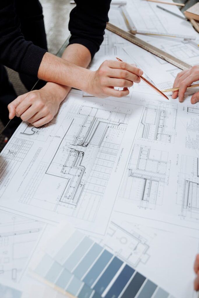 Engineer reviewing construction drawings on site